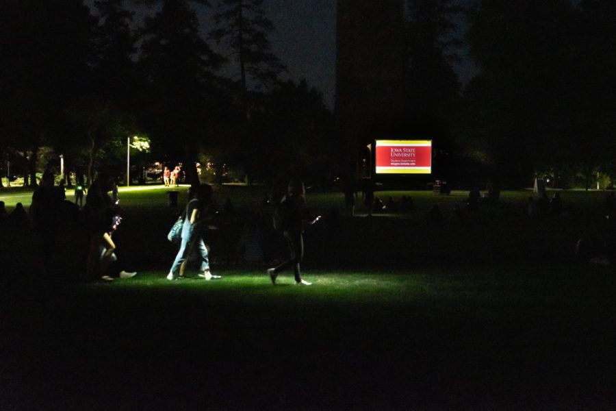 Students used flashlights to find an open patch of grass to enjoy Black Panther.