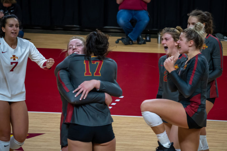 Eleanor Holthaus hugs Candelaria Herrera while other Cyclones celebrate an Iowa State point against Texas Tech on Saturday. Iowa State lost the match 3-2 to Texas Tech.