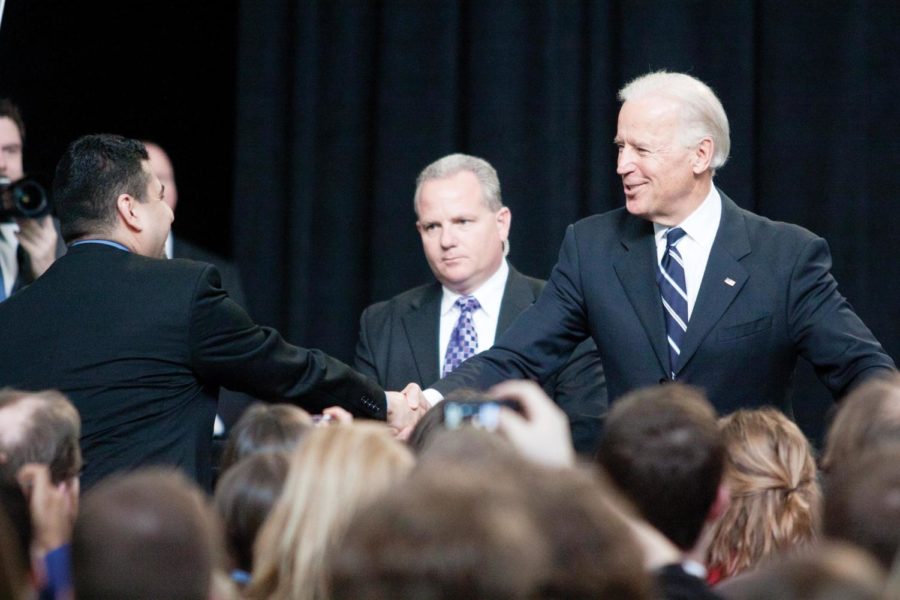 Then-Vice President Joe Biden shakes hands with an audience member before asking a question on March 1, 2012, in Howe Hall. Biden spent time at the end of his speech taking questions from the audience.
