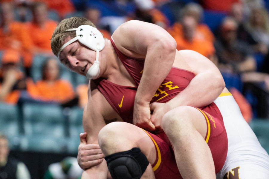 Iowa States Gannon Gremmel fights for position with Wyomings Brian Andrews in their heavyweight championship match on March 8 at the Big 12 Championships inside the Bank of Oklahoma Center in Tulsa.