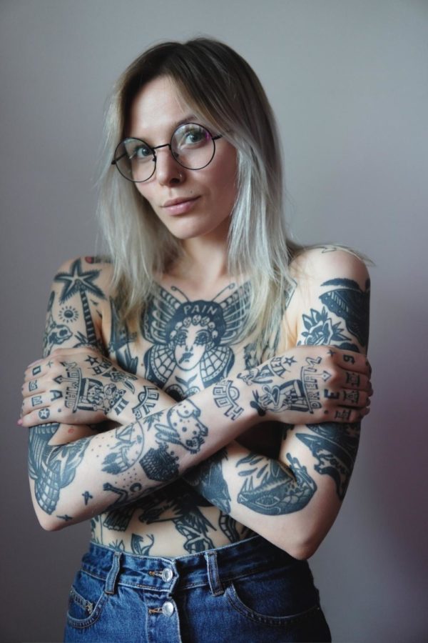 Tattoos are professional and individuals in the workplace should not be discriminated against for having them.