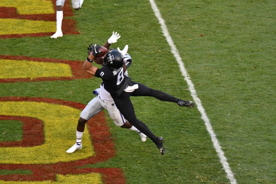 Iowa State wide receiver Xavier Hutchinson (No. 8) hauls in a contested touchdown catch against Kansas State on Nov. 21 in Jack Trice Stadium. Hutchinson had a career high 111 receiving yards. 