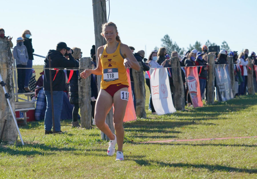 Senior Cailie Logue crosses the finish line as she wins her third straight Big 12 individual title Friday at the Big 12 Championship. (Photo credit: Denny Medley/Random Photography)
