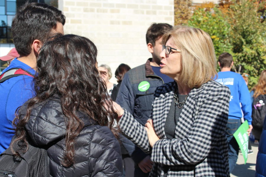 Rita Hart, Iowa state senator, speaks with supporters about her plans as potential lieutenant governor of Iowa in the free speech zone on Oct. 23, 2018. Hart supports improvements to the local economy, supports workplace development and attracting good-paying jobs to improve our states quality of life.