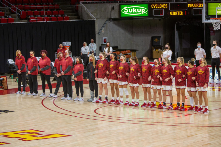 The+Iowa+State+womens+basketball+team+stands+on+the+court+locked+in+arms+pregame+against+Omaha+on+Nov.+25+at+Hilton+Coliseum.