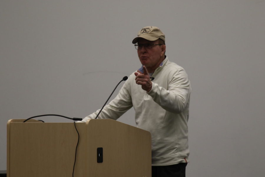 Dan+Gable%2C+former+Iowa+State+wrestler%2C+speaks+at+the+Ames+Public+Library+on+Oct.+17%2C+2018.+Gable+answered+questions+from+the+audience+before+signing+copies+of+his+book.