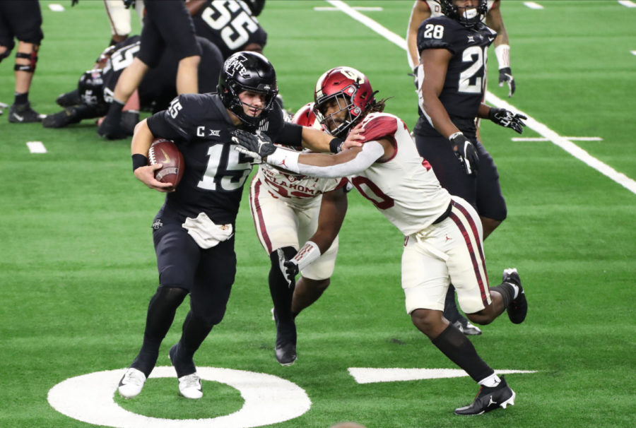 Iowa State quarterback Brock Purdy gets forced out of bounds by Oklahoma defenders during the 2020 Dr. Pepper Big 12 Football Championship at AT&T Stadium in Arlington, Texas on Dec 19, 2020.
