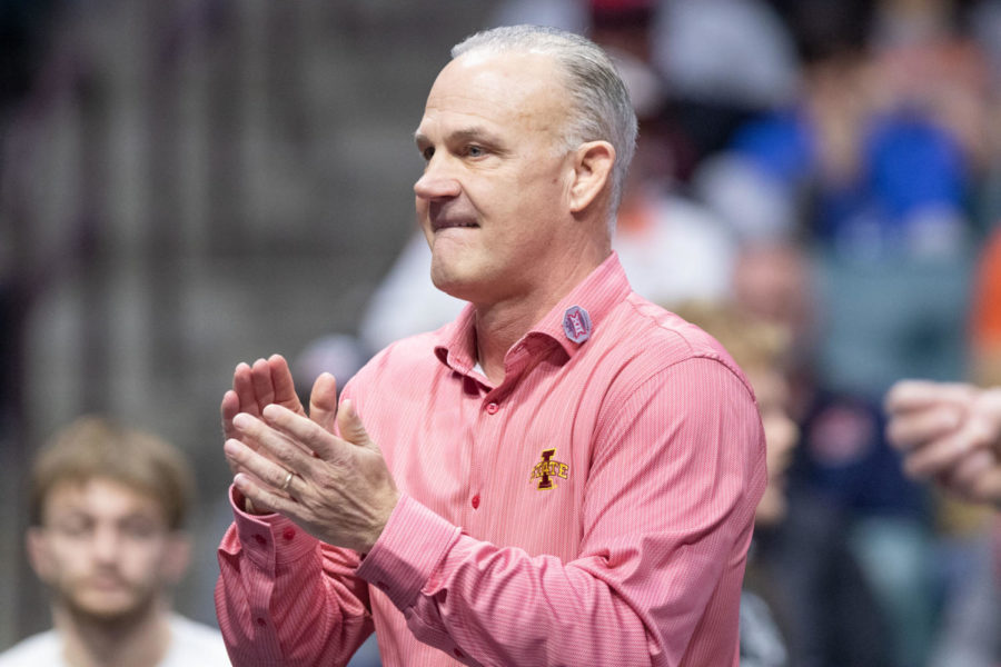 Iowa State Head Coach Kevin Dresser claps during a match at the Big 12 Championships on March 8 inside the Bank of Oklahoma Center in Tulsa.