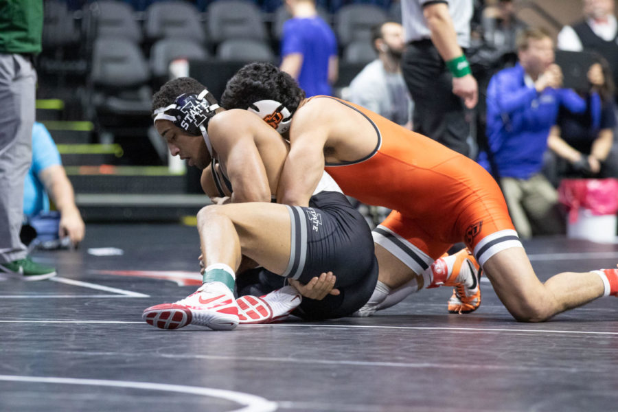 Iowa State's Marcus Coleman tries to get out of Oklahoma State's Anthony Montalvo's grip in their consolation semifinal match at 184 pounds on March 8 at the Big 12 Championships inside the Bank of Oklahoma Center in Tulsa.