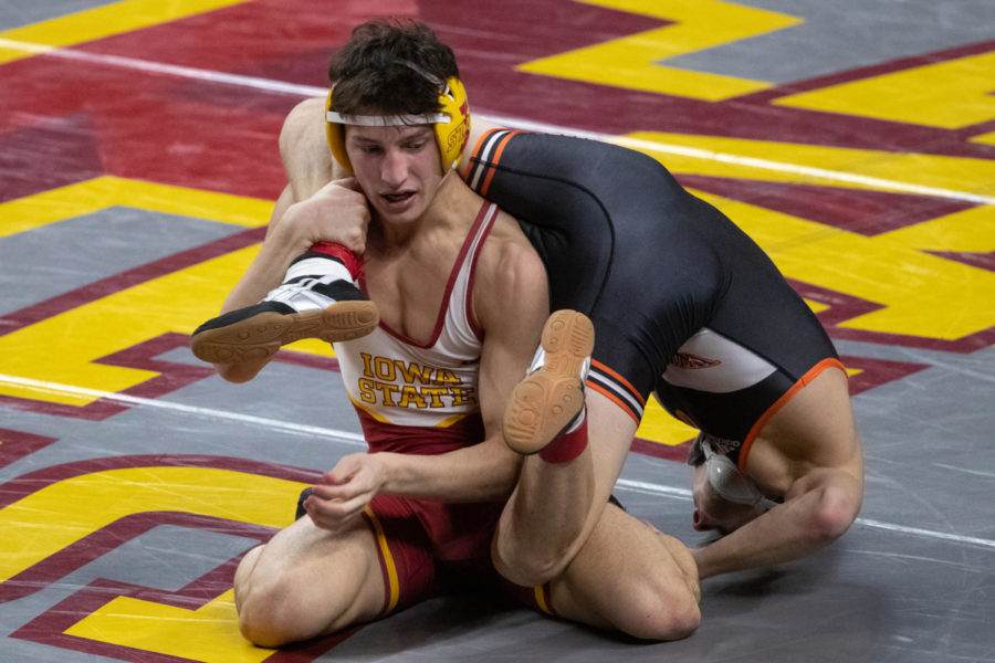 Iowa State freshman Zach Redding attempts to control the legs of Wartburg wrestler Joe Pins. Redding defeated Pins by technical fall (16-1) on Jan. 3. (Photo courtesy of Wesley Winterink/Iowa State Athletics)