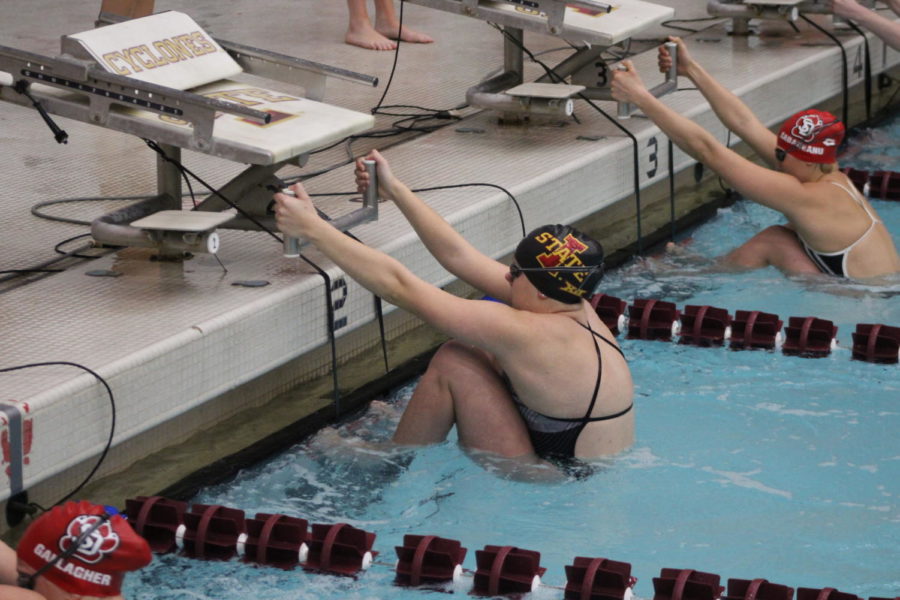 Sophomore Jazlyn Horras takes her start for the 100 back event Friday. Iowa State won the meet with South Dakota 212-84.
