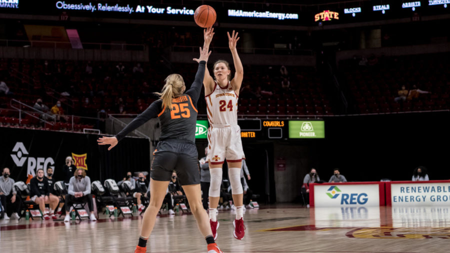 Iowa State junior guard Ashley Joens shoots the ball over an Oklahoma State defender in Iowa States win Wednesday.
