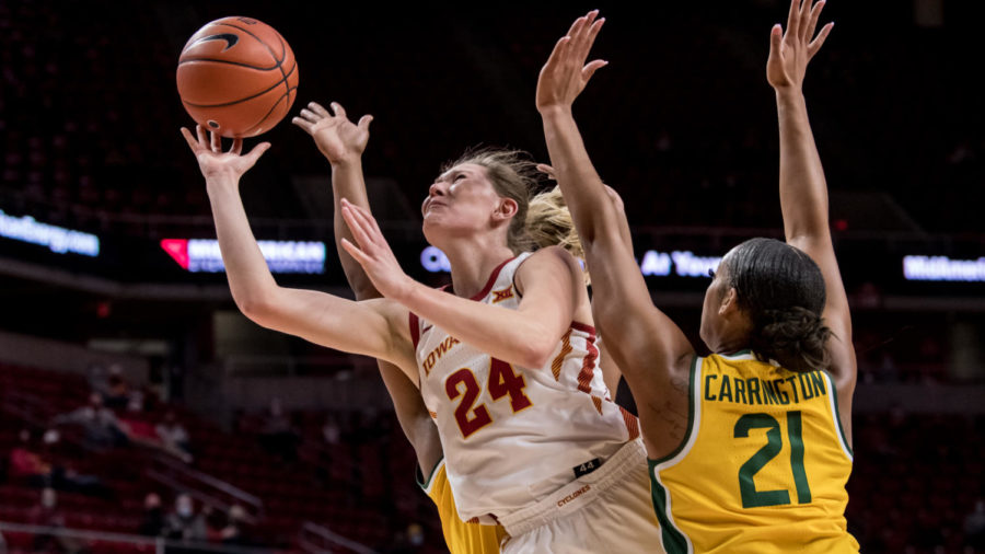 Iowa State junior Ashley Joens (No.24) fights through contact to try and score against No.9 Baylor in Hilton Coliseum on Sunday. (Photo courtesy of LUKE LU/Iowa State Athletics)