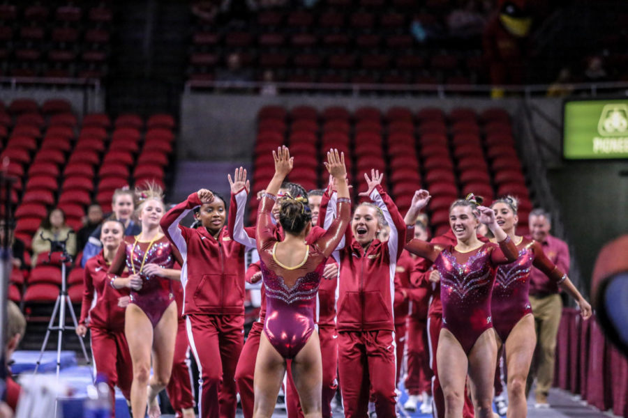 The+Iowa+State+gymnastics+team+celebrates+after+a+landing+was+stuck+during+the+vault+part+of+the+competition+on+March+15%2C+2019+in+Hilton+Coliseum.%C2%A0