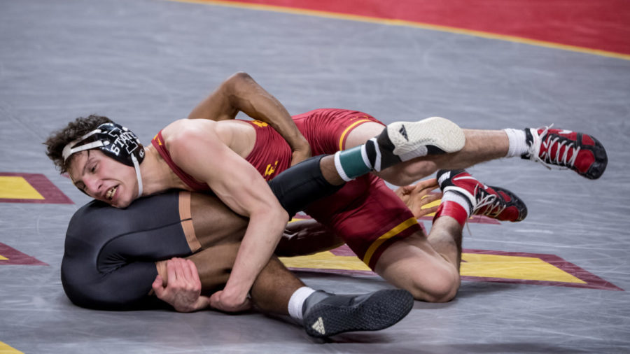 Zach Redding fights for positioning against Arizona States Michael McGee on Feb. 14.