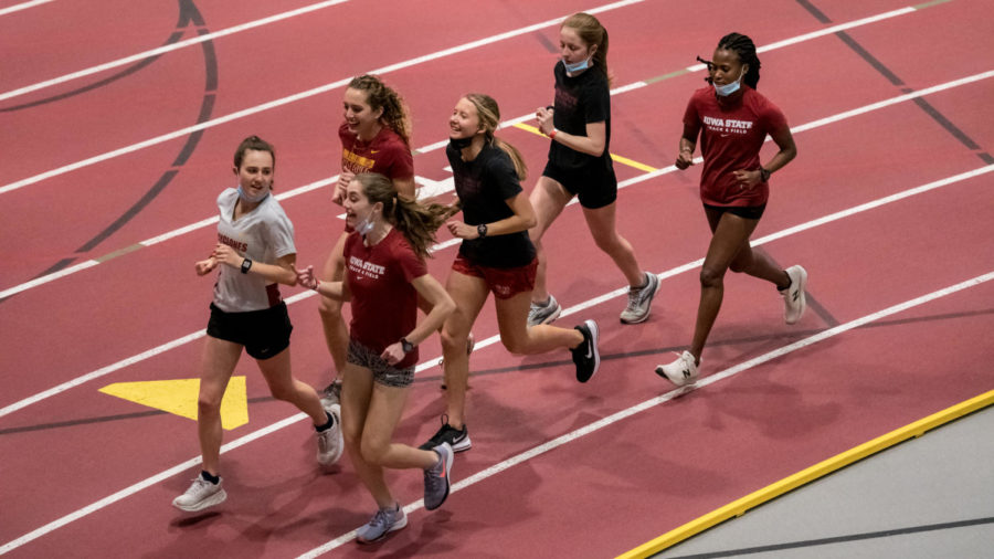 The Iowa State track and field womens distance team warms up together Feb. 12 ahead of the Iowa State Classic in Lied Recreation Athletic Center. 