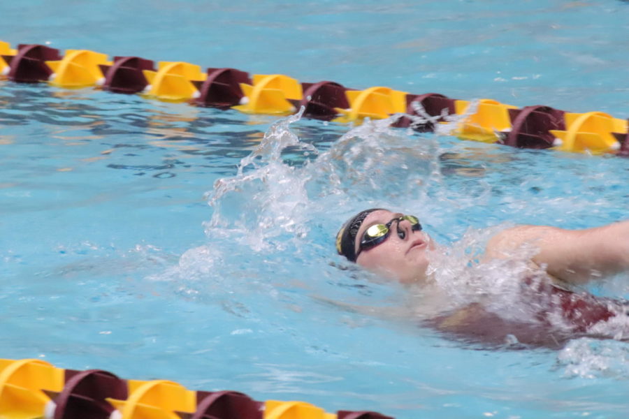 Freshman Emily Haan swims the 200-yard backstroke in Beyer Pool on Jan. 18. Iowa State University womens Swimming and Diving team won against Illinois State University with 191-100. 