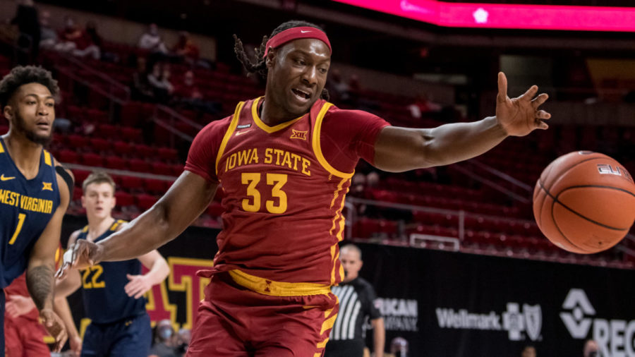Iowa State forward Solomon Young goes for the ball in Iowa States game against No. 17 West Virginia on Tuesday in Hilton Coliseum. The 76-72 loss was Youngs first game back from health and safety protocols.