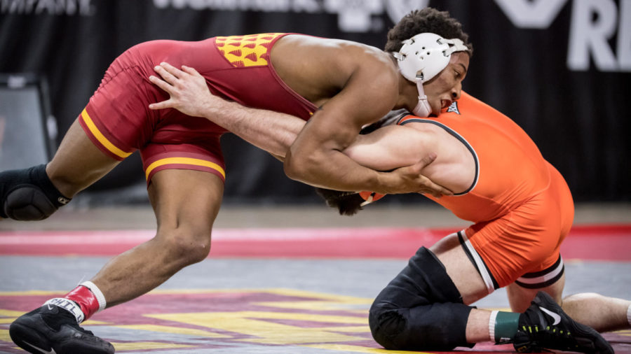 David Carr wrestles against Oklahoma States Wyatt Sheets on Jan. 31 at Hilton Coliseum. Carr and the Cyclones lost to the Cowboys 16-15. 