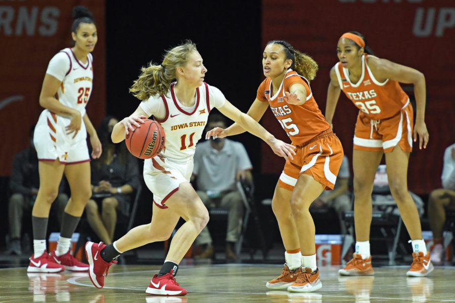 Emily Ryan makes a pass to a teammate against Texas during the Phillips 66 Big 12 Womens Basketball Championship on Friday at Municipal Auditorium in Kansas City, Missouri.