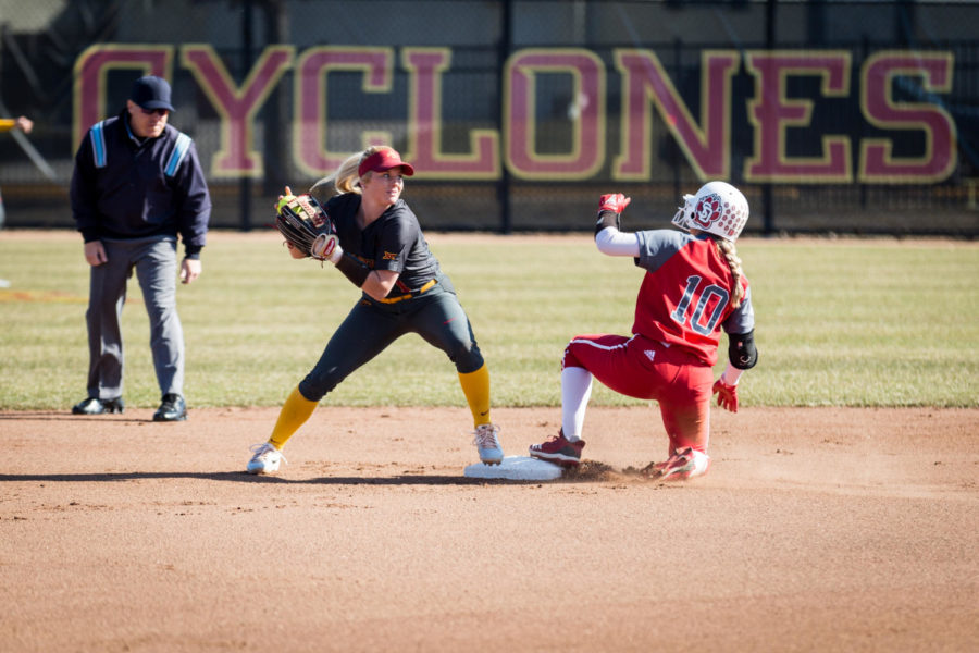 Iowa State then-freshman Kasey Simpson gets South Dakota then-junior Camille Fowler out at second base then throws to first during the Iowa State vs. South Dakota softball game held at the Cyclone Sports Complex on April 2, 2019. The Cyclones had three home-run hits and defeated the Coyotes 9-1.