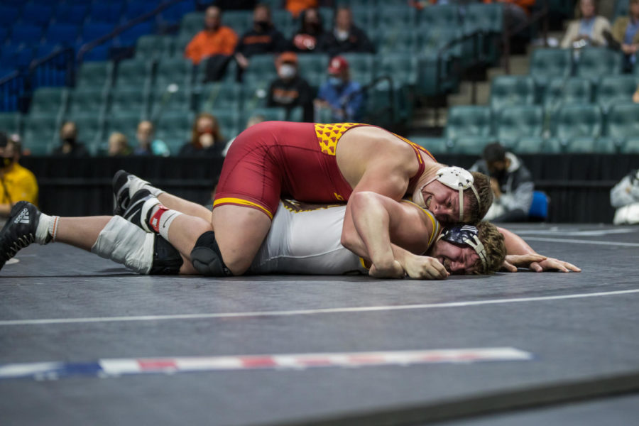Iowa State senior Gannon Gremmel gains ride time against Wyoming’s Brian Andrews in the heavyweight final Sunday of the Big 12 wrestling championships.