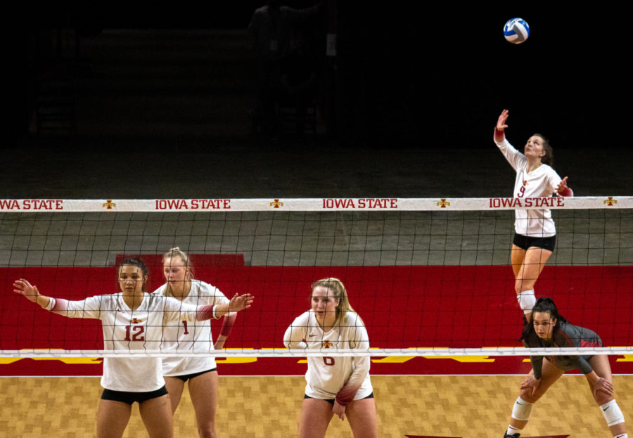 Sophomore outside hitter Annie Hatch attempts a serve during the second set against Wayne State on March 26. The Cyclones defeated Wayne State 3-1.