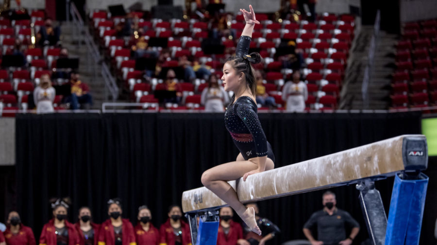 Meixi Semple does a routine on the balance beam against Denver in Iowa States gymnastics meet Jan 15.