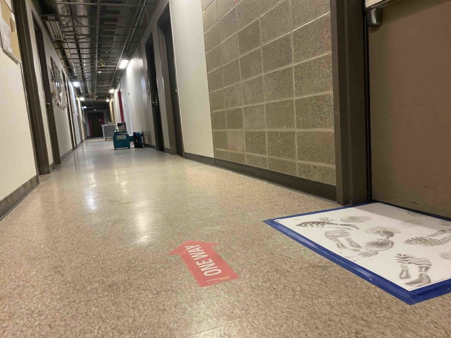 Soot continues to track through the halls of Ross while the emergency response team removes the ceiling tile throughout the building. 