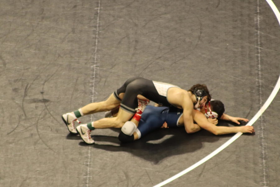 Iowa States Ian Parker tries to turn Fresno States DJ Llooren in their semifinal match in the 2021 Championships on March 6, 2021. Parker defeated Lloren 5-2 in the BOK Center in Tulsa, Oklahoma. 