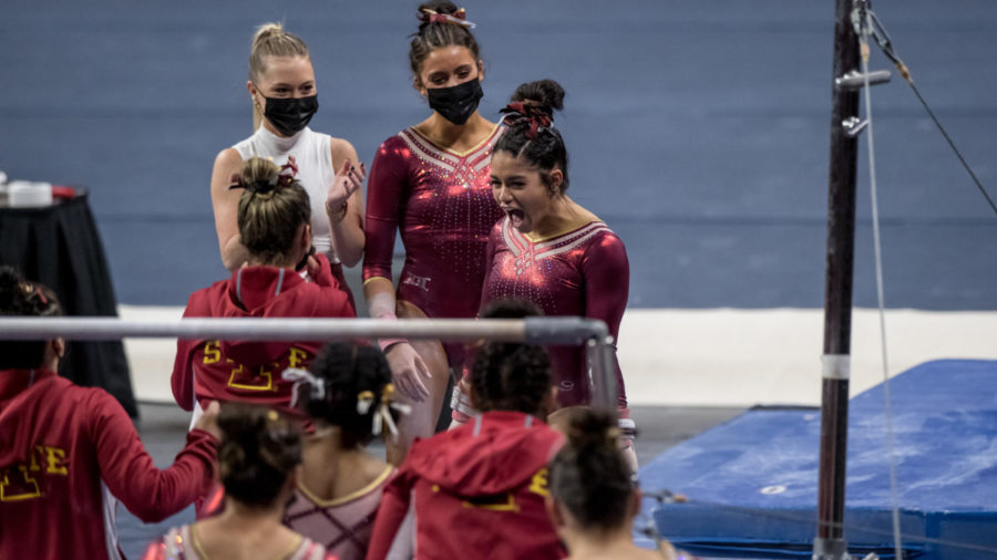 Addy De Jesus celebrates with her teammates after a routine in Iowa State gymnastics meet against Northern Illinois on March 12. 