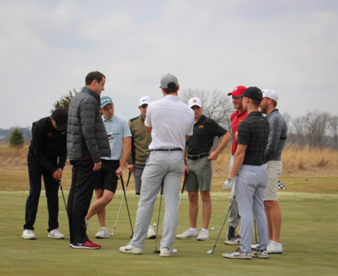 Iowa State mens golf coach Andrew Tank talks with the golf team April 5, 2019 at practice.