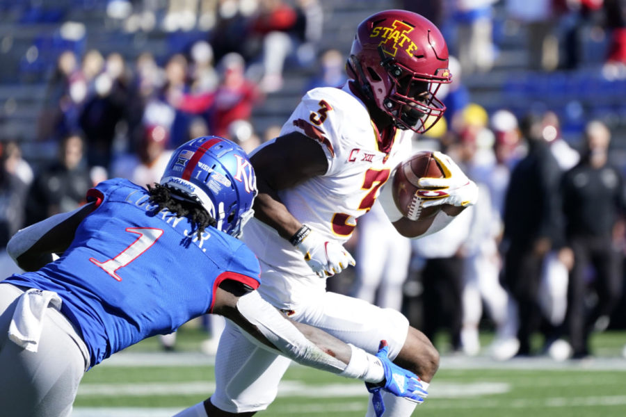 Iowa State running back Kene Nwangwu runs for a touchdown past Kansas safety Kenny Logan Jr. during the first half against Kansas in Lawrence, Kansas, on Oct. 31. 