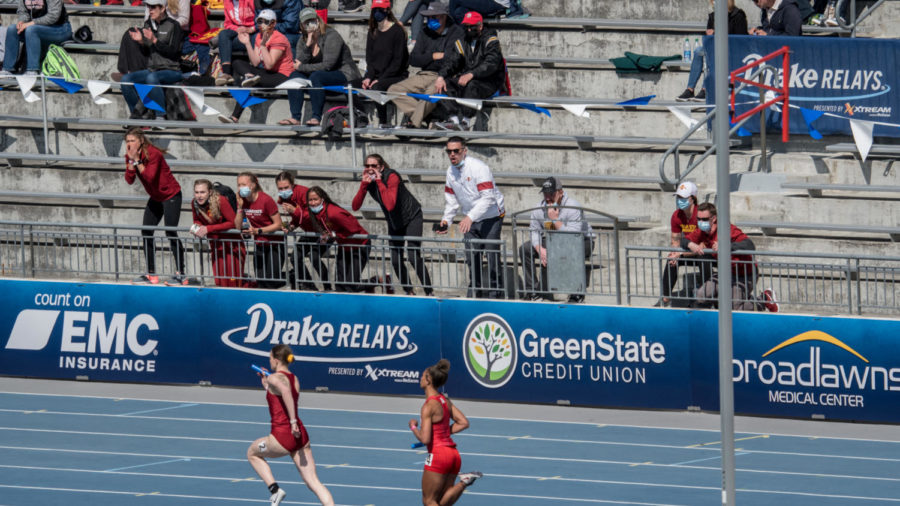 Members of the Iowa State womens track and field team cheers on their teammates at the Drake Relays on Saturday.