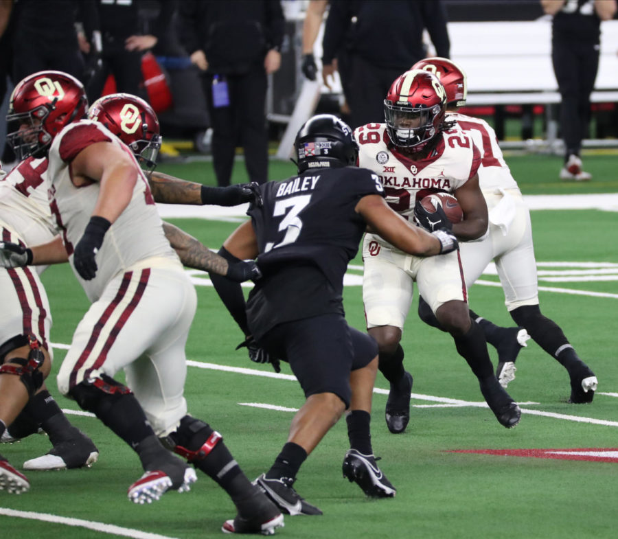 Iowa State defensive end JaQuan Bailey tries to tackle Oklahoma running back Rhamondre Stevenson in the 2020 Dr. Pepper Big 12 Football Championship on Dec. 19.