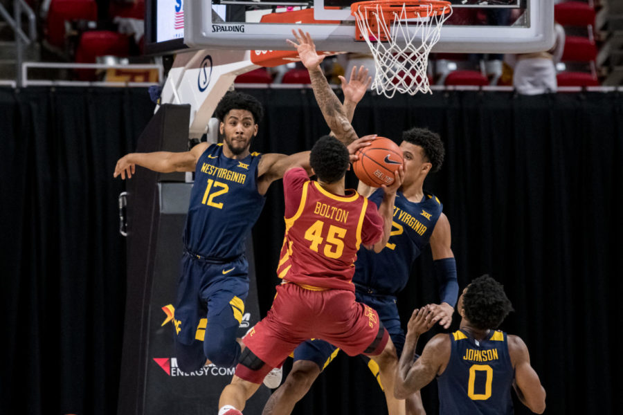 Iowa State guard Rasir Bolton fights through contact as he goes toward the rim against then-No. 17 West Virginia on Feb. 2.