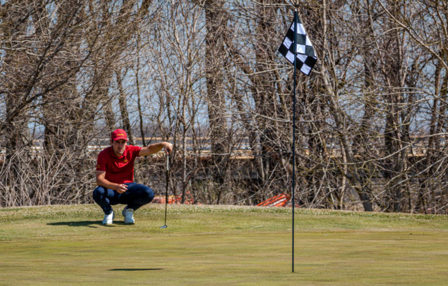 Then-junior golfer Lachlan Barker lines up his putt April 3, 2021, at Coldwater Golf Links. 