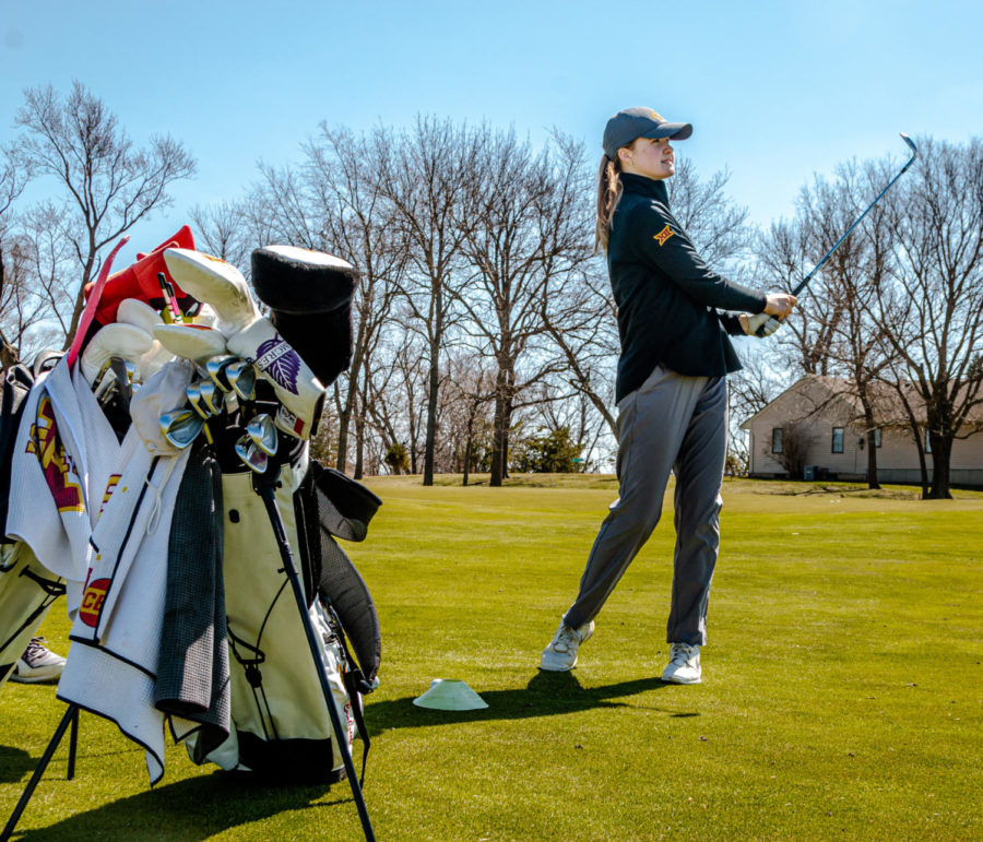 Freshman Ellie Braksiek practices chip shots April 1 at The Golf Performance Center.