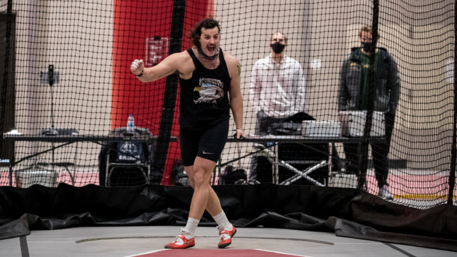 Vlad Pavlenko celebrates in the mens weight throw event at the Iowa State Classic on Feb. 12 in Lied Recreation Athletic Center. Pavlenko won the event with a personal best 22.36 meters.