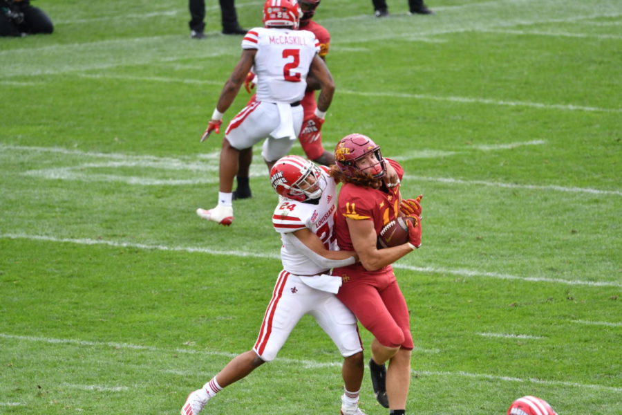 Iowa State tight end Chase Allen is tackled by Louisiana safety Bralen Trahan during the first half Sept. 12.