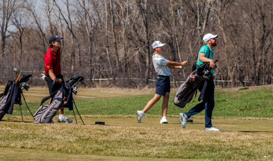 Members of the Iowa State mens golf team watch a drive travel down the fairway at Coldwater Golf Links on April 3, 2021.