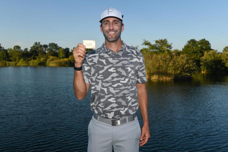 Former Iowa State golfer Chris Baker holds up his name after earning a PGA Tour card Sept. 2, 2019.