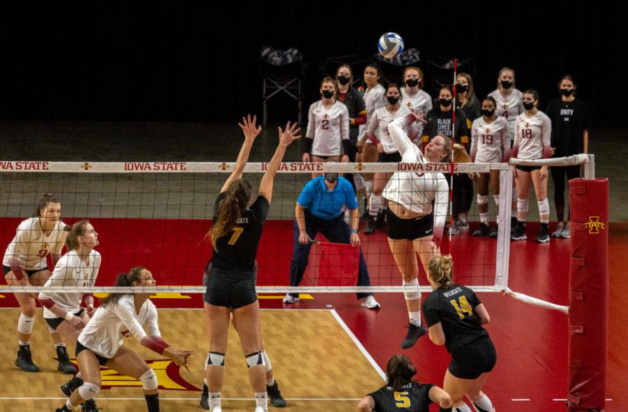 Junior right side Eleanor Holthaus goes up for a spike against Wayne State on March 26. The Cyclones were victorious, defeating the Wildcats 3-1.