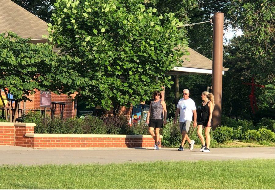 Visitors on Iowa State’s campus enjoy a walk without masks now that the mask mandate for the university is no longer in effect.