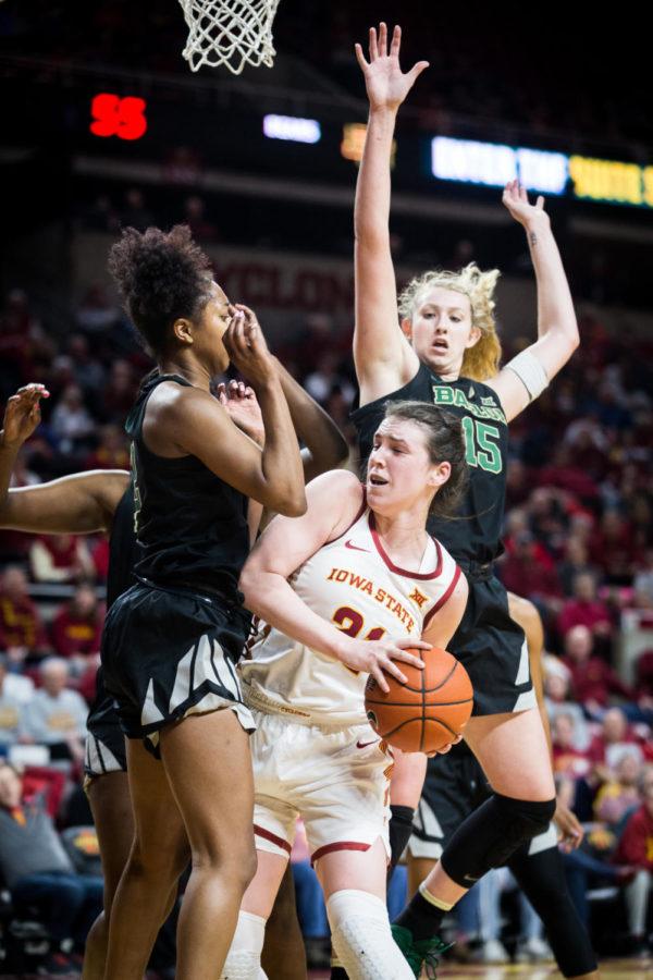 Iowa State senior guard Bridget Carleton is guarded under the hoop during the second half of the Iowa State vs. Baylor women’s basketball game Feb. 23, 2019, at Hilton Coliseum. The Lady Bears defeated the Cyclones 60-73 despite a surge from Iowa State in the second half.