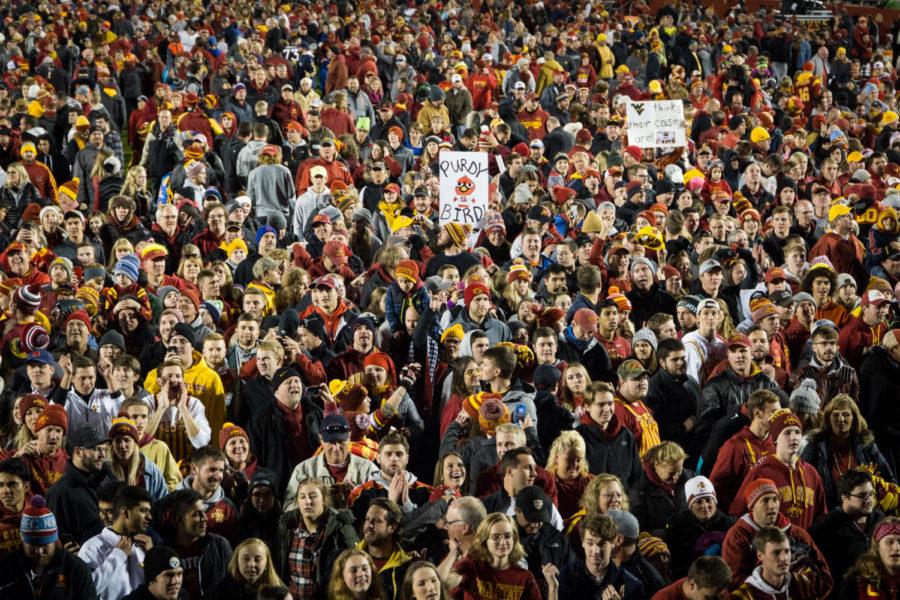 Iowa State football fans rush the field with signs dedicated to quarterback Brock Purdy following the Iowa State vs. West Virginia upset on Oct 13, 2018. The Cyclones beat No.7 West Virginia 30-14.