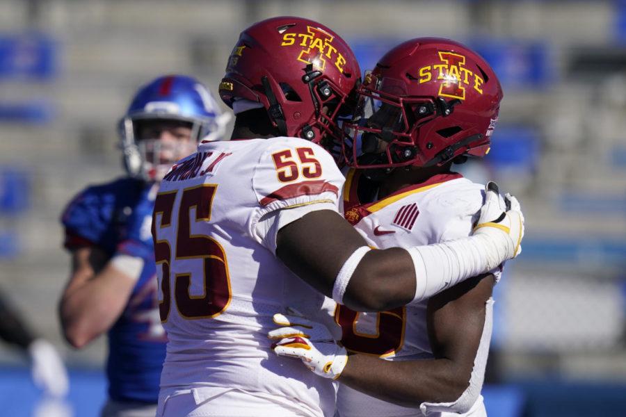 Iowa State running back Breece Hall, right, and offensive lineman Darrell Simmons Jr. (55) celebrate a touchdown during the second half against Kansas in Lawrence, Kansas, on Oct. 31, 2020. (AP Photo/Orlin Wagner)