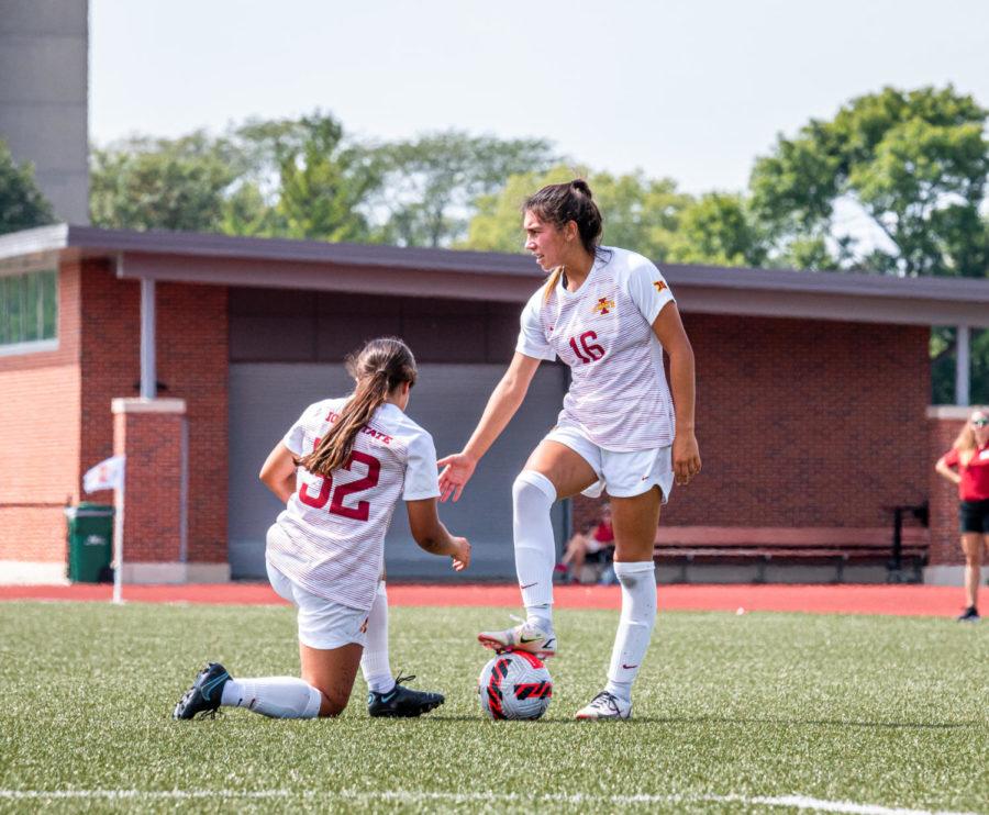 Junior midfielder Claudia Najera helps up midfielder Mira Emma following a foul outside the box. The Cyclones fell to the Bulldogs 2-1 in Sunday afternoons matchup.
