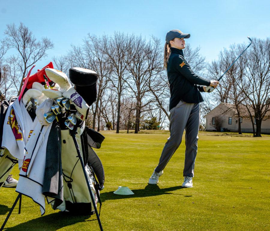Freshman Ellie Braksiek practices chip shots April 1 at The Golf Performance Center.