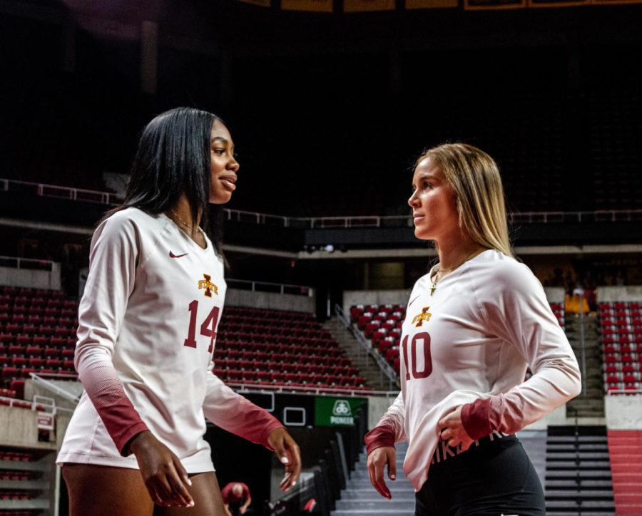 Solei Thomas (left) and Kate Shannon (right) chat at Iowa State volleyball media day on Tuesday. Thomas enters the Iowa State program after transferring from Clemson.
